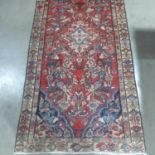A hand knotted woollen Hamadan rug - 198cm x 98cm
