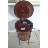 An Edwardian inlaid and decorated mahogany Tyrela wind up parlour gramophone of oval shape on