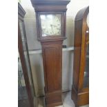 An oak 30 hour longcase clock with an 11 inch square painted dial, 74 inches tall