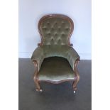 A Victorian walnut spoon back armchair 98cm tall