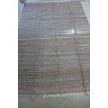 A hand knotted woollen Shiraz Kilim rug - 305cm x 200cm