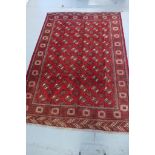 A hand knotted woollen Turkman rug - 288cm x 205cm