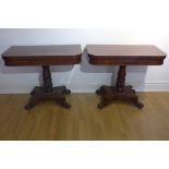 A pair of 19th century mahogany fold over card tables on a carved and turned column on a