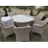 A Brambelcrest Portobello 135cm round table with six armchairs, ex-display