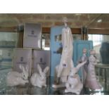 Two Lladro figures, Medico and Boda de Antano, and three bunnies - all good and boxed