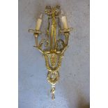 A set of eight brass ribbon top twin branch wall lights, 72cm tall