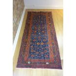 A hand knotted woollen Luri rug - 275cm x 132cm