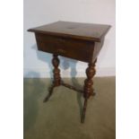 A 19th century mahogany work table on twin pillar supports, with two drawers, one with marquetry