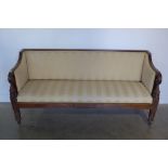 An early 19th century mahogany scroll arm settee recently re-upholstered - 188cm wide, 92cm tall,