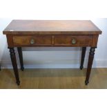 A 19th century mahogany two drawer side table on turned reeded legs, 87cm tall x 117cm x 52cm