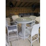 A Bramblecrest Chester 96cm round bar table and four bar stools, ex-display