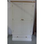 A white painted double wardrobe with a single drawer, 197cm high, 107cm wide