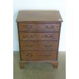 A small mahogany four drawer chest, 71cm tall x 52cm x 31cm