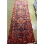 A hand knotted woollen Karajeh rug - 321cm x 108cm