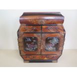 An oriental inlaid marquetry and mother of pearl jewellery cabinet with a series of small drawers,