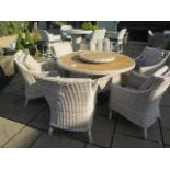 A Bramblecrest Ascot dining set, table 140cm with ceramic top, lazy Susan and six armchairs, ex-