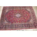 A hand knotted woollen Kashan rug - 342cmx 254cm