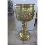 A large brass Armorial twin handle planter, 111cm tall x 50cm diameter, ideal ice bucket for a