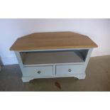 A painted corner TV unit with an oak top