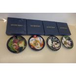 Four Moorcroft pin dishes all boxed, in good condition