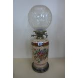A Doulton Lambeth floral decorated stone ware oil lamp with a Hinks Duplex burner, some crazing