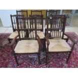 A set of eight oak dining chairs, including two carvers, rush seats - in good condition