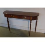 A mahogany two drawer D-end side table cross banded in yew wood, standing on tapered turned and