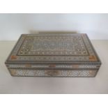A Damascus inlaid box, 7x30x19cm - in good condition with key