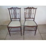 A pair of fine quality late Victorian mahogany and inlaid single chairs bearing a Jas Shoolbred