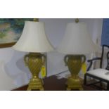 A pair of gilt decorative table lamps, with shades 78cm tall
