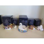 Five boxed Royal Crown Derby paperweights, Mallard, Swan, and three collectors guild pieces,