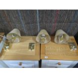 Six brass wall lights with shades