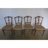 A set of four Victorian walnut dining chairs with turned reeded front legs, all in good condition,