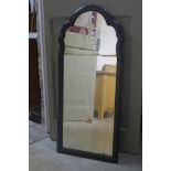 A large walnut framed mirror with Prince of Wales feathers intalgio in the glass, height 94cm, width