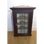 A mahogany glazed corner cupboard, 102cm tall x 70cm wide