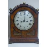 A good quality late 18th century English bracket clock, the arched case veneered in mahogany with