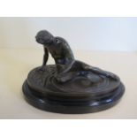 A bronze figure, the wounded Gaul on a black marble base, 11cm tall, 18cm wide, damage to base
