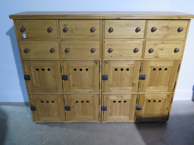 A good quality waxed pine bank of eight drawers and eight cupboards - 155cm wide
