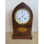 A lancet inlaid mahogany mantle clock striking on a bell, in running order, 37cm tall