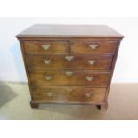 A Georgian oak chest with two short over three long drawers and panelled sides 92cm tall x 95cm, x