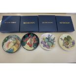 Four Moorcroft pin dishes all boxed, in good condition