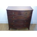 A Georgian mahogany bow fronted five drawer chest on splayed bracket feet, 97cm tall x 94cm x 51cm