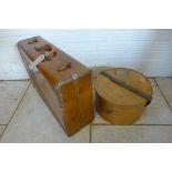 A vintage Samsonite retro suitcase and a bentwood hat box with North East Railways label