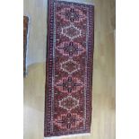 A hand knotted woollen Karajeh rug - 200cm x 72cm