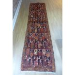 A hand knotted woollen Hamadan runner 320cm x 85cm