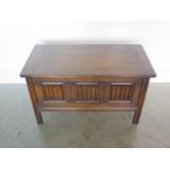 A 20th century oak three panel coffer with linen fold decoration, in polished condition, 52cm tall x