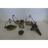Five bronze oil lamps and a brass pourer