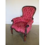 A mahogany button back armchair