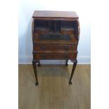 A small tambour front mahogany writing desk, with two drawers - 96cm tall x 57cm x 45cm - tambour