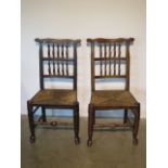 Two oak spindle back rush seated side chairs